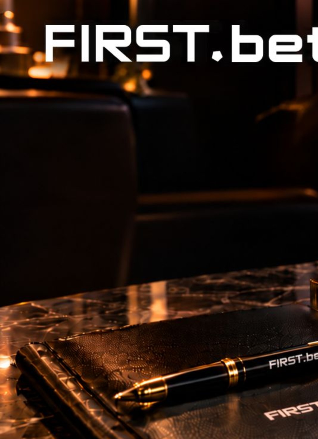 FIRST.bet logo above a FIRST.bet branded leather notebook and pen at the FIRST.bet Cigar Lounge, SiGMA World Rome