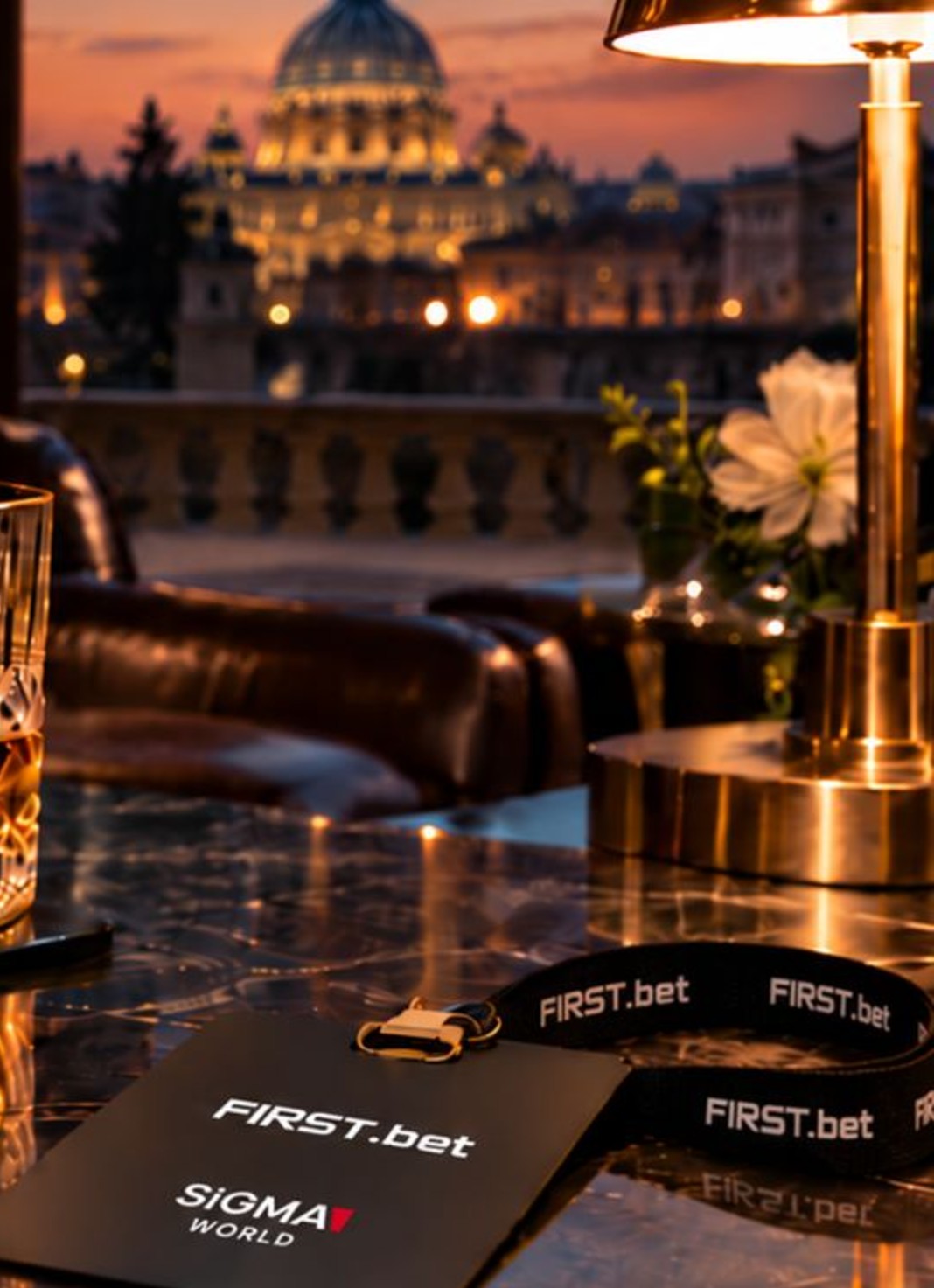 St Peter’s Basilica at dusk behind a brass lamp and a FIRST.bet SiGMA World lanyard at the FIRST.bet Cigar Lounge in Rome